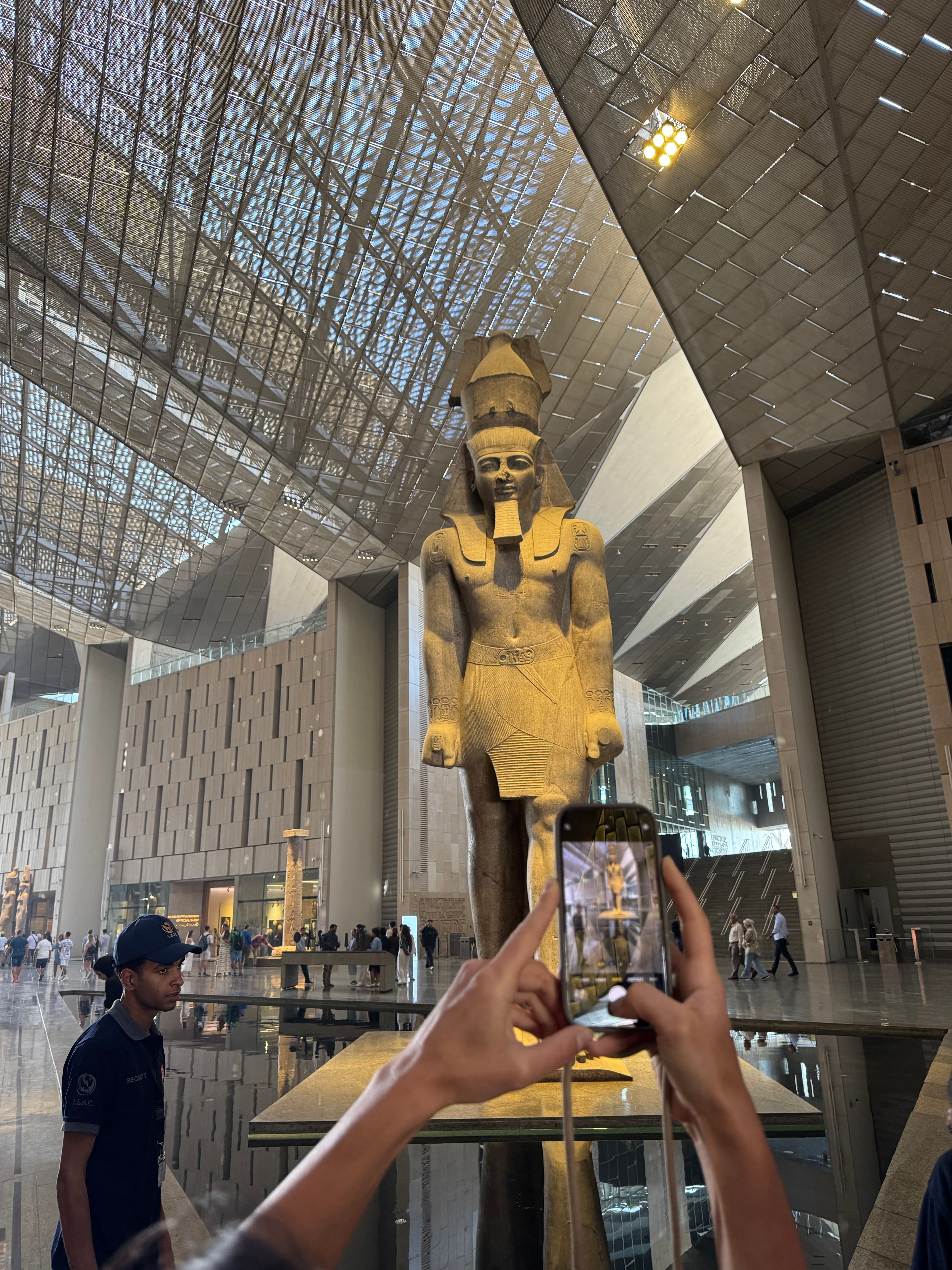 Ancient Egyptian colossus in the Grand Egyptian Museum hall