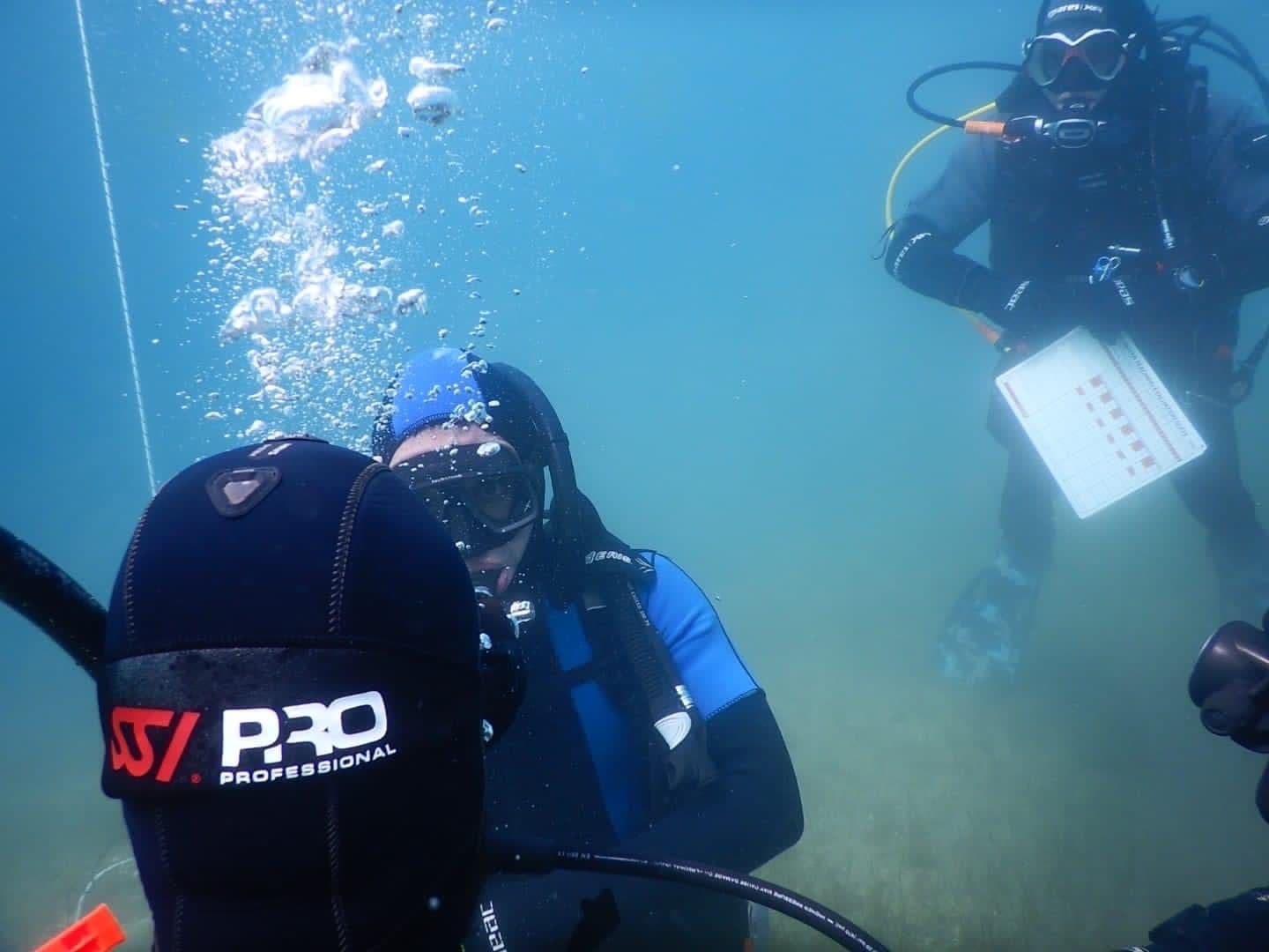 A diving instructor supervising an underwater training exercise
