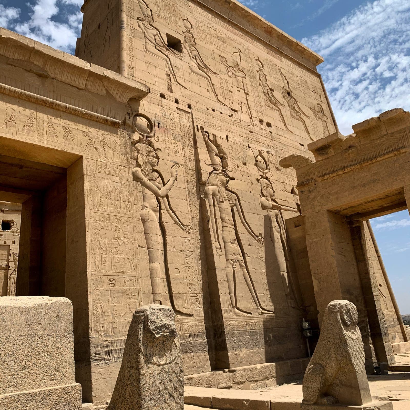 Ancient Egyptian temple facade with carved figures