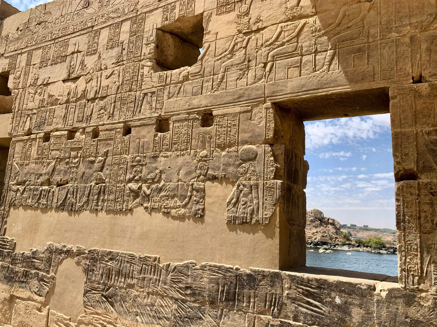 Temple wall reliefs beside the Nile